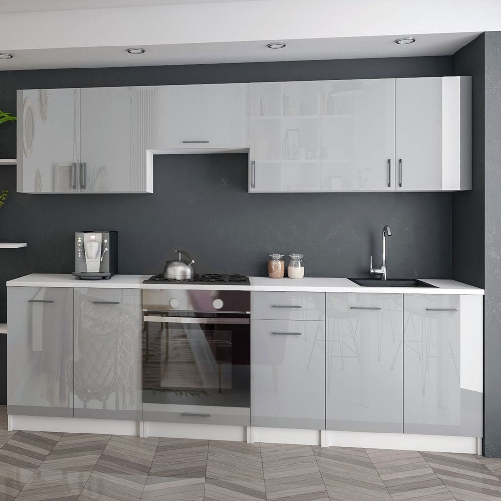 A modern, minimalist kitchen with high-gloss gray cabinets and white countertops.