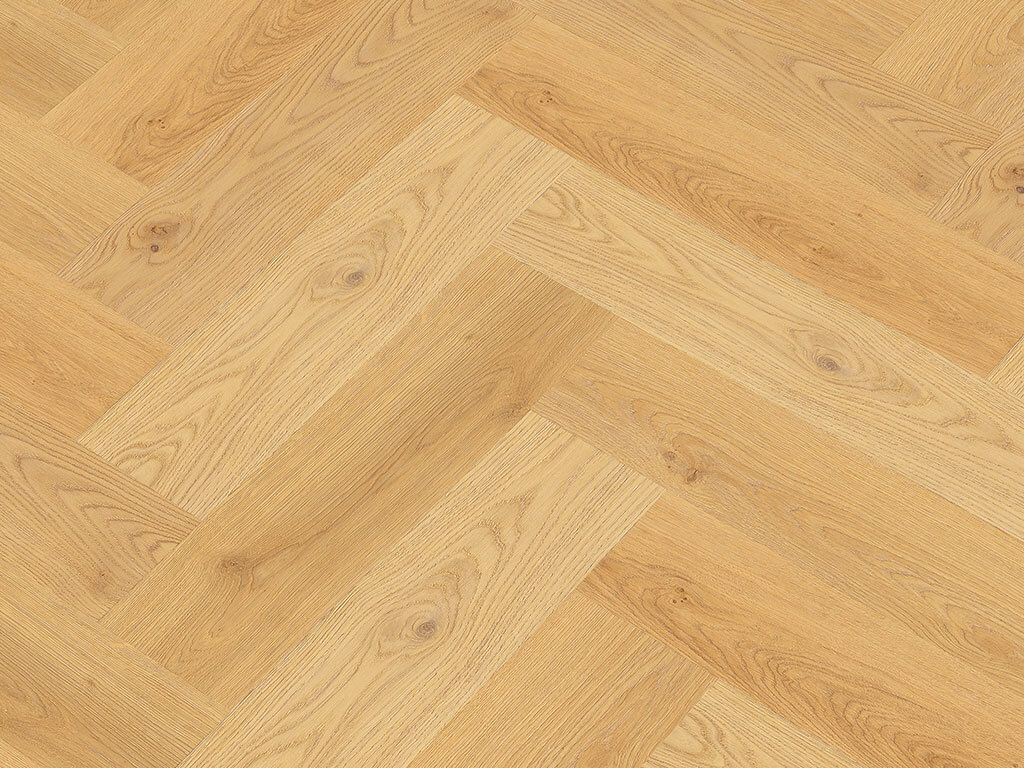 A close-up, overhead view of a herringbone-patterned wooden floor.