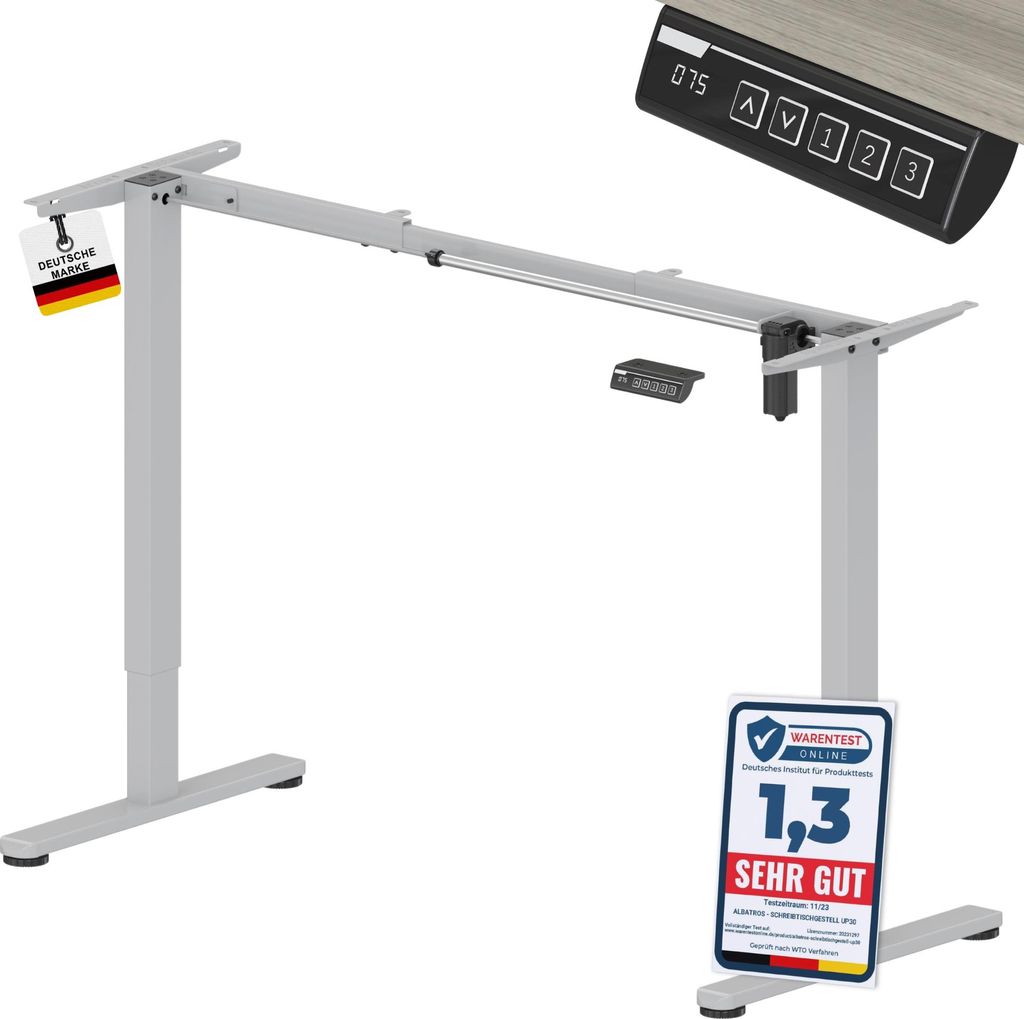A silver electric height-adjustable desk frame with a control panel and a test certificate.