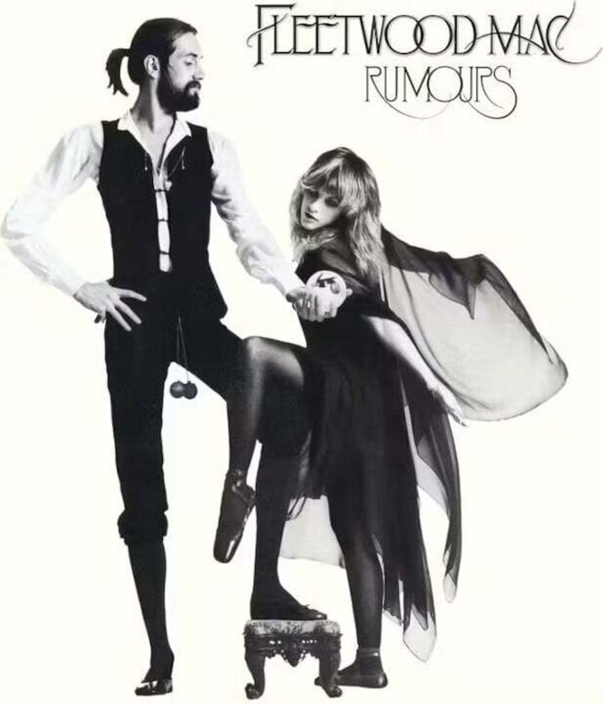 A black and white studio portrait of a man and a woman from the album cover of Fleetwood Mac's "Rumours".