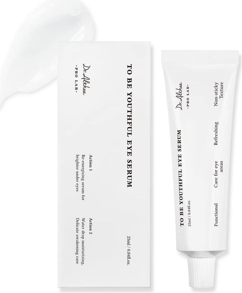 A product shot of an eye serum tube and its packaging, with a dollop of the serum beside it.