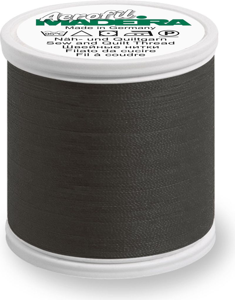 A spool of dark gray thread on a white background.