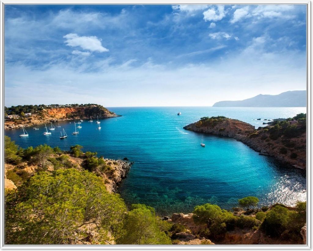 Wallario Wandbild Ibiza - Blick von einer Bucht aufs Meer, Größe: 40,30 x 50,30 cm, Poster mit weißem Aluminiumrahmen