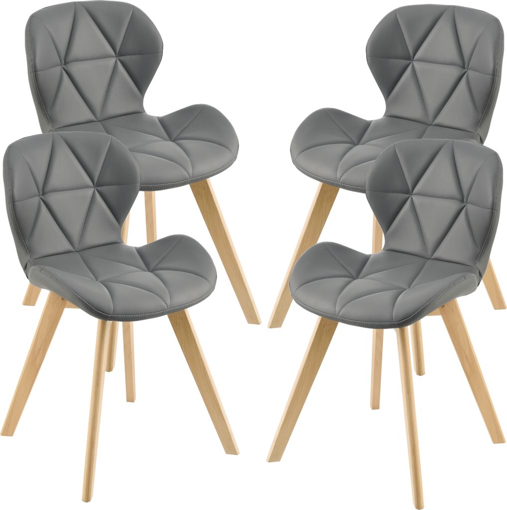 Four gray chairs with wooden legs arranged in a studio setting.