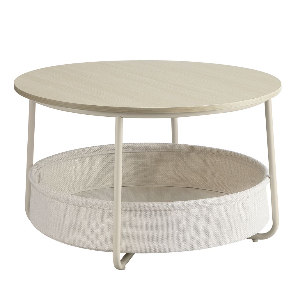 A round coffee table with a fabric storage basket underneath.