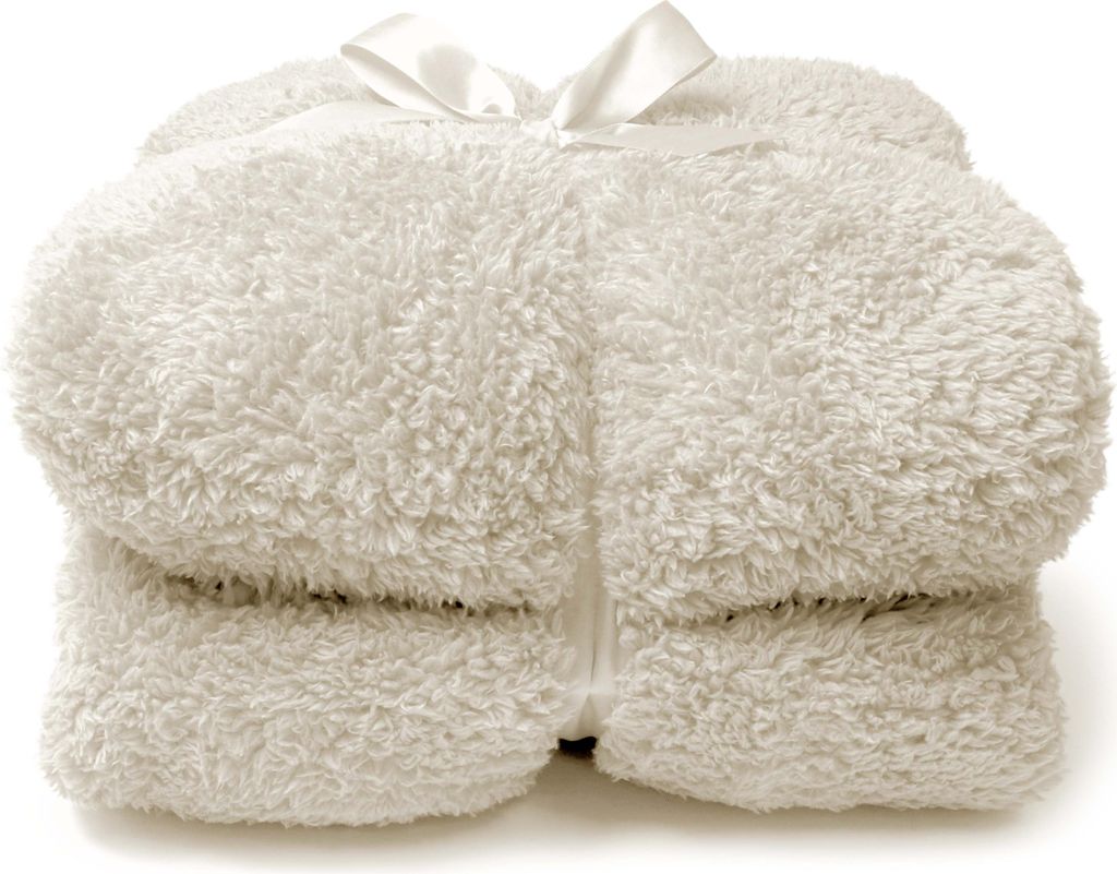 A folded white fluffy blanket tied with a white ribbon.