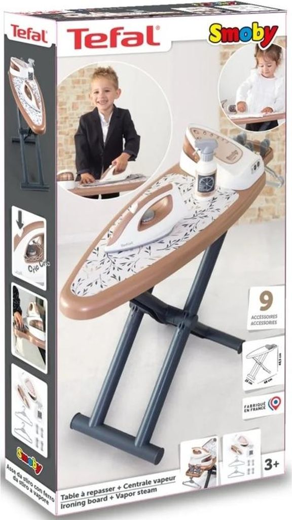 The image shows the product packaging for a Smoby Tefal ironing board with a steam station. The packaging features images of the product, a child playing with it, and various accessories.