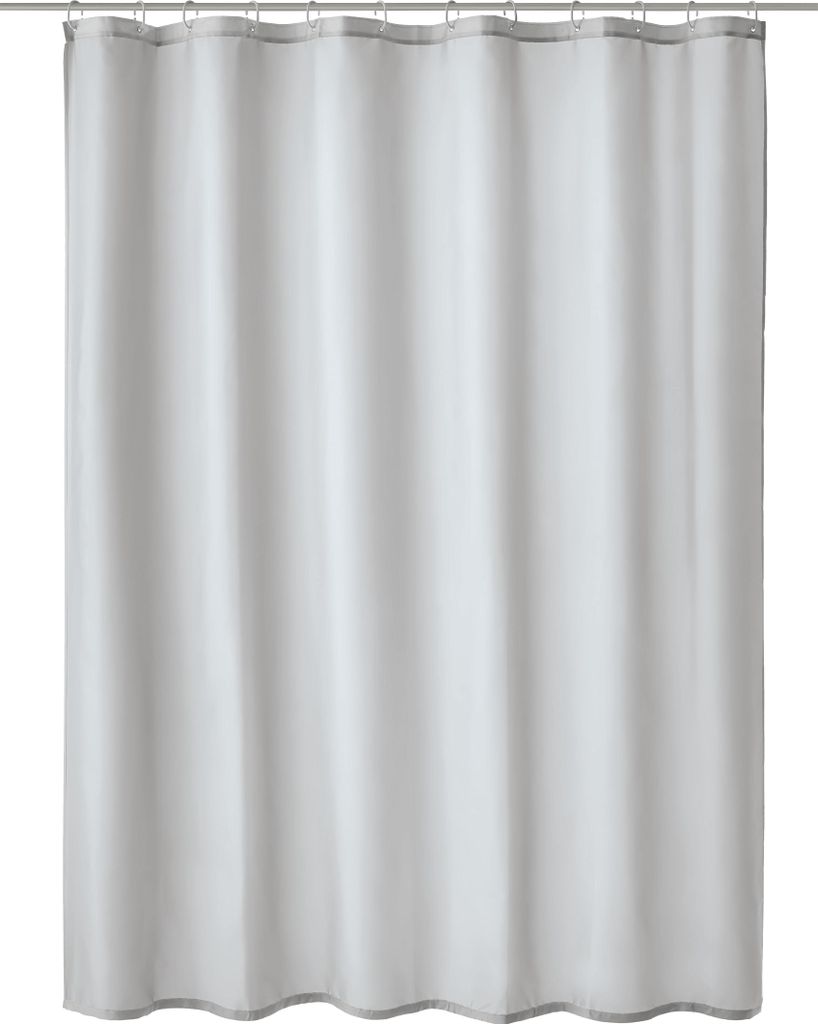 A plain white background with a grey and white shower curtain hanging.