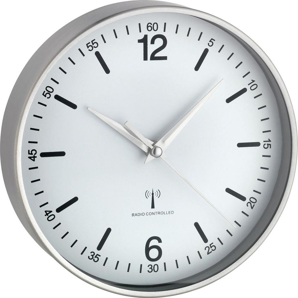 A close-up, studio shot of a white analog wall clock with a silver frame.