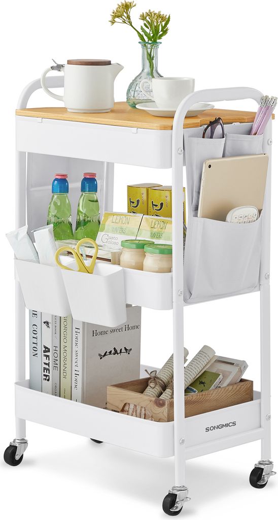 A white rolling cart with three shelves, a wooden top, and various items on it, including books, jars, bottles, and office supplies.