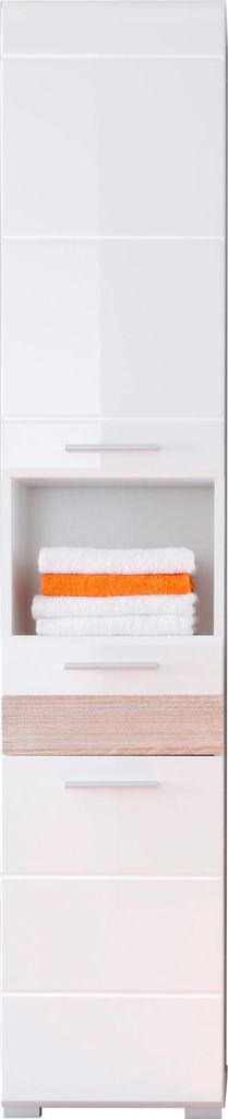 A tall, narrow cabinet or shelving unit with a recessed shelf containing stacked towels or cloths. The unit is predominantly white with a light wood-colored accent panel.