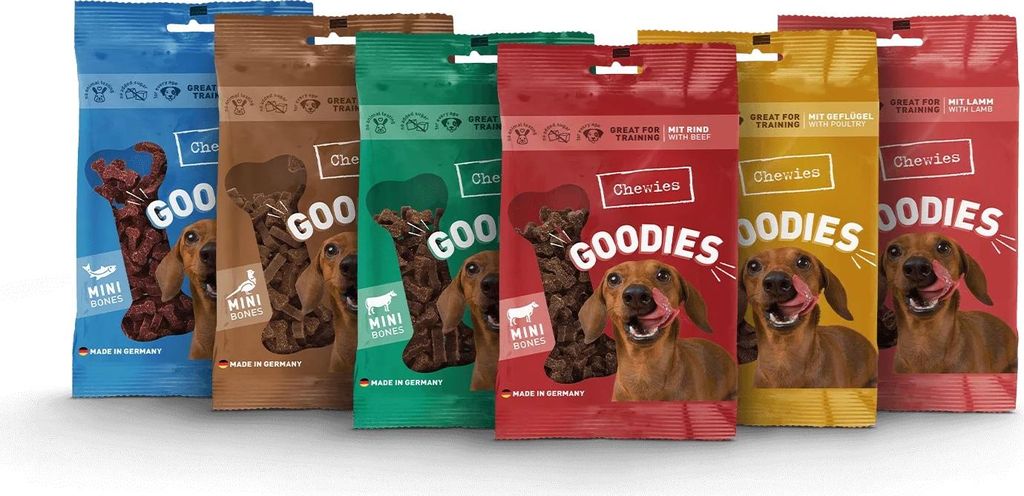 A collection of dog treat bags arranged in a row.