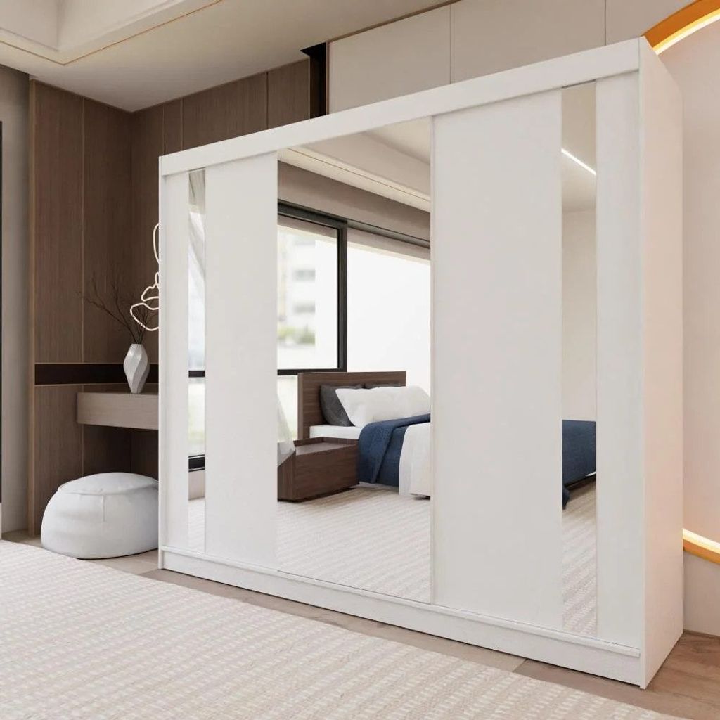 A white sliding door wardrobe with mirrored panels is shown in a bedroom setting.
