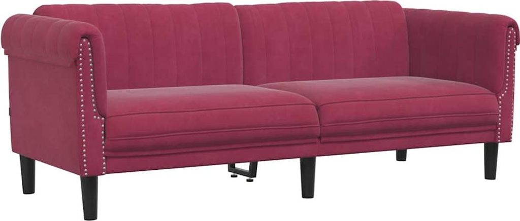 A studio shot of a burgundy velvet sofa.