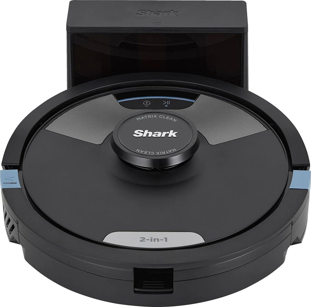 A black robot vacuum cleaner with a charging dock.