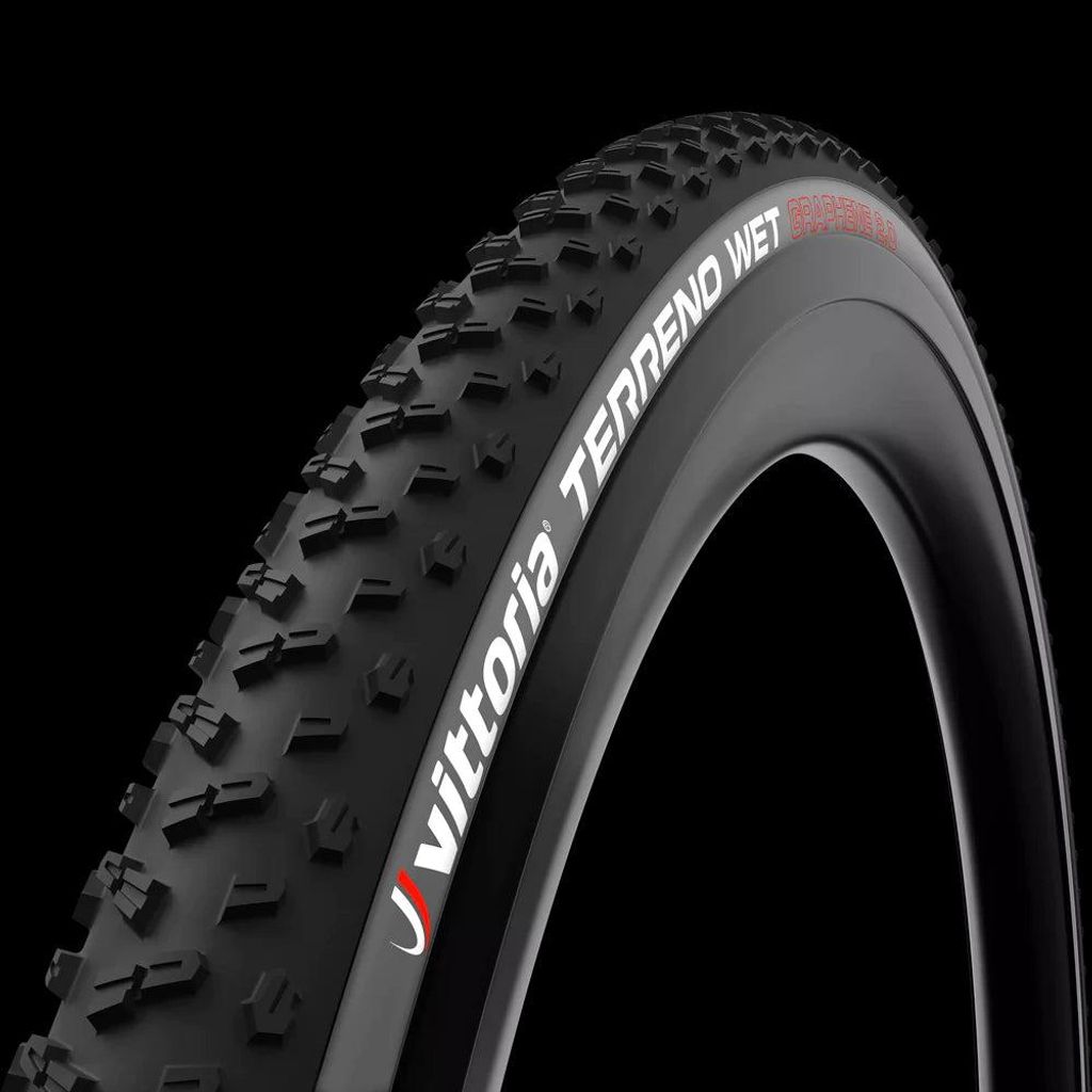 A close-up studio shot of a bicycle tire against a black background.