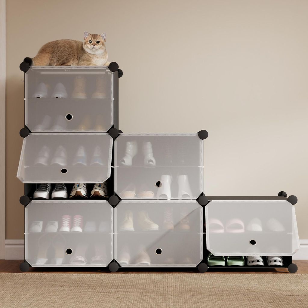 A cat is sitting on top of a modular shoe rack unit.