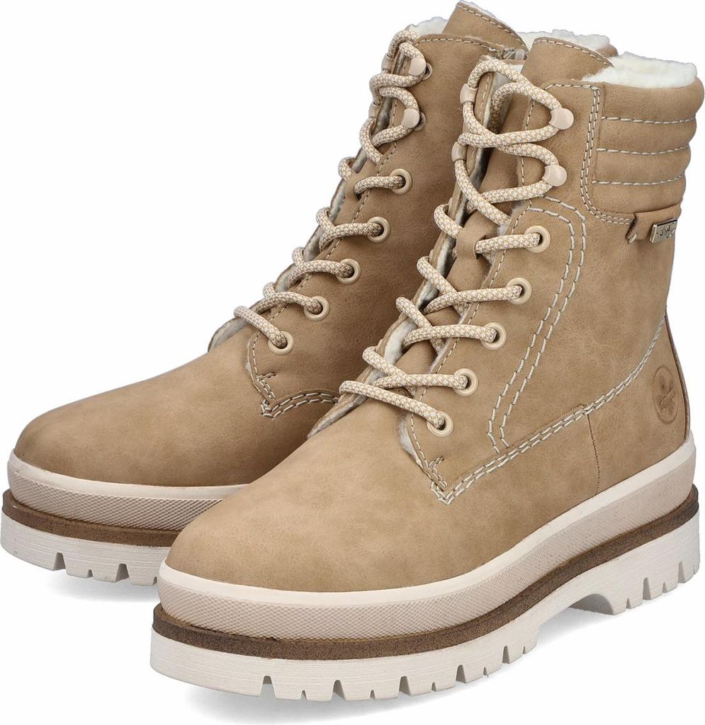 A pair of beige women's boots with white laces and thick white soles, presented against a white background.