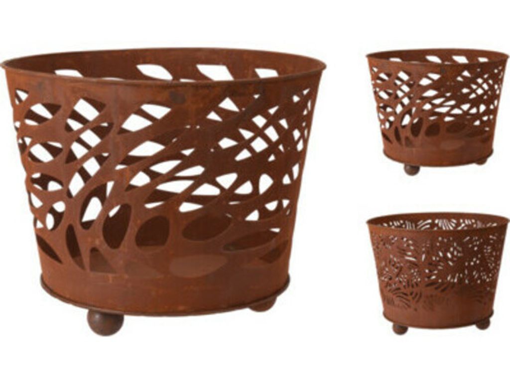 Three rusty metal planters with cut-out designs are displayed against a white background.
