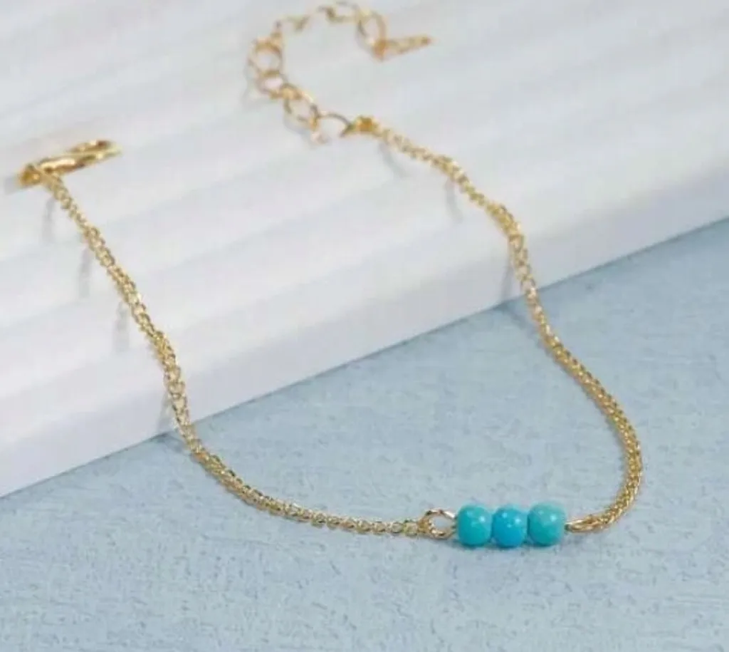 Bijou fantaisie : Bracelet femme en cuivre doré orné de perles turquoises