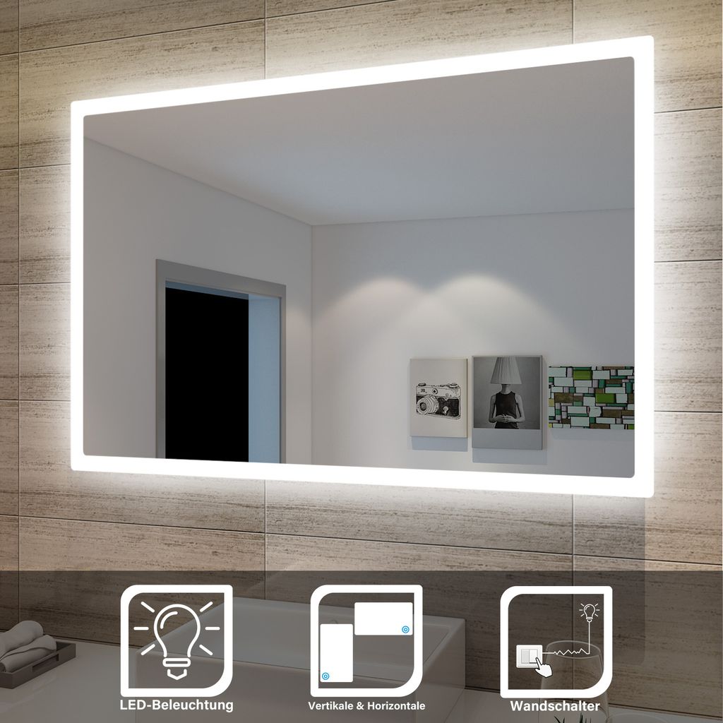 A well-lit bathroom mirror with integrated LED lighting, showcasing its features through icons and text overlays.
