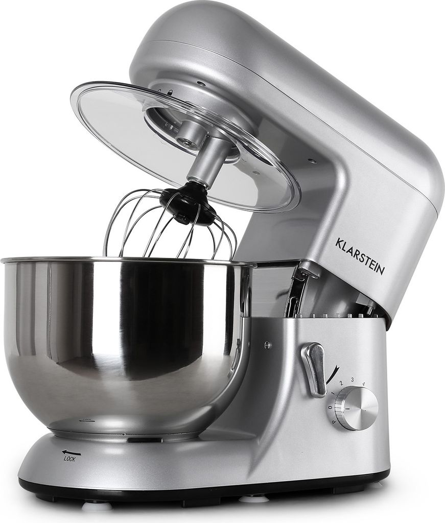 A silver stand mixer is shown from a side-angle with the mixing bowl and whisk attachment visible.