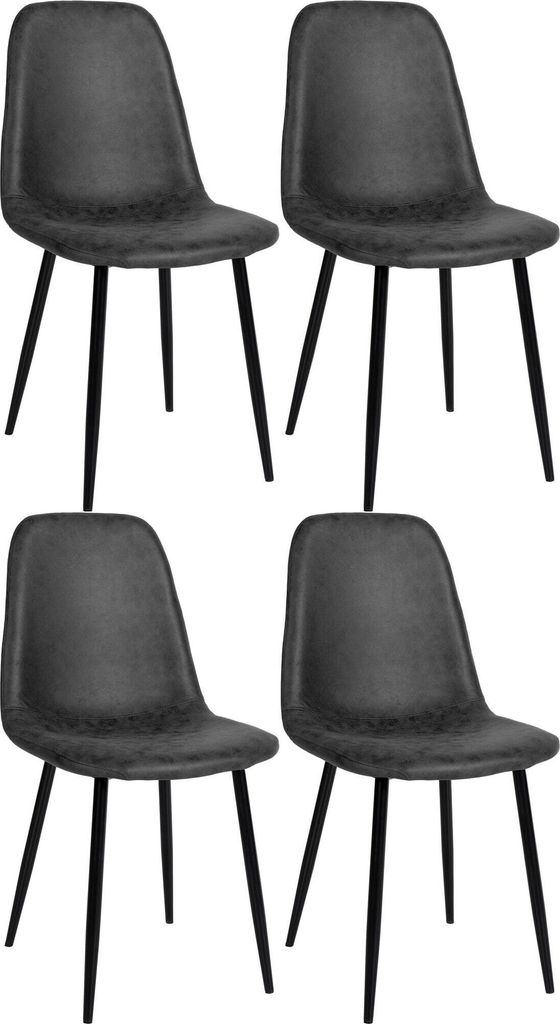 Four black dining chairs are arranged in two rows of two against a white background.