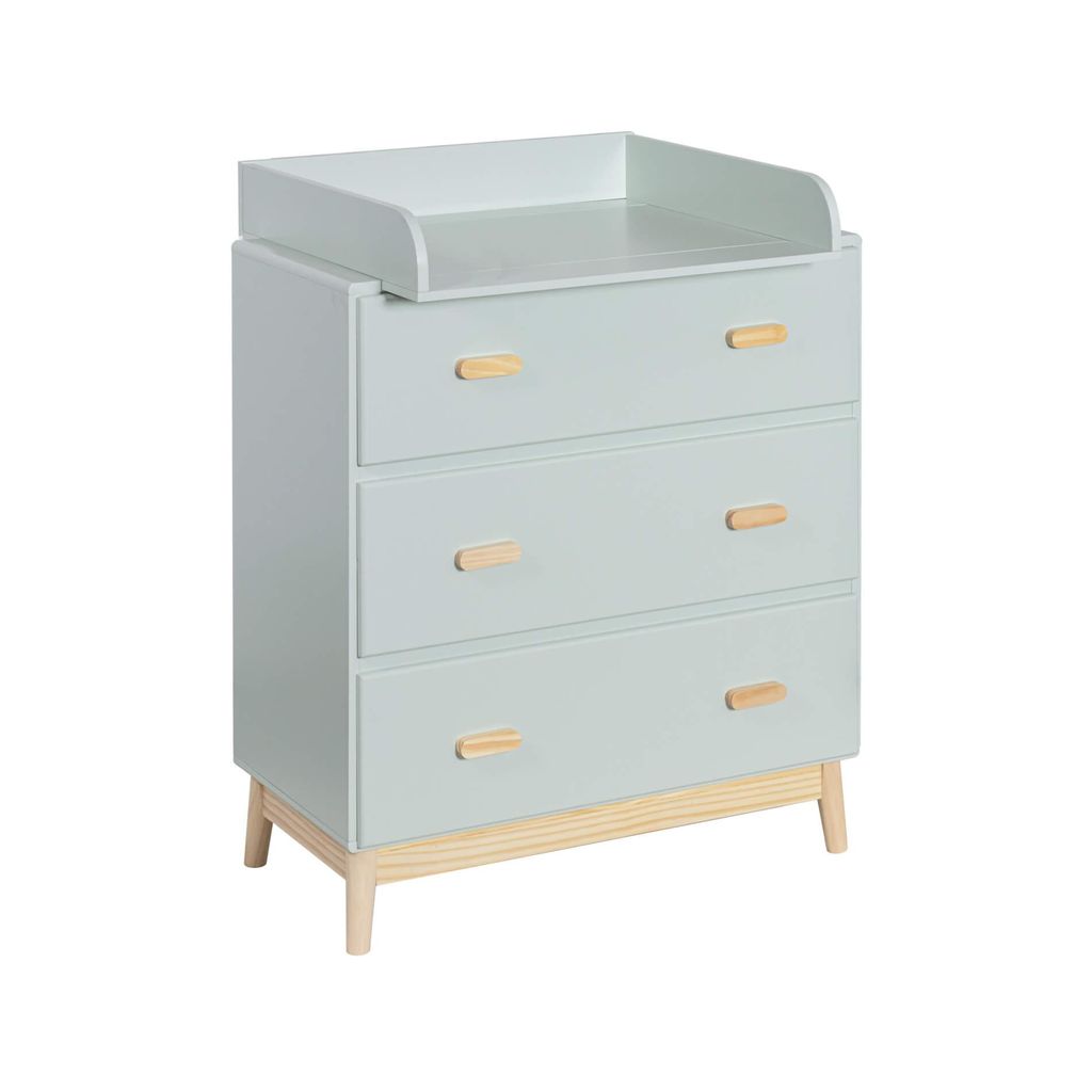 A light green changing table with wooden accents and three drawers, shown from a three-quarter angle against a white background.