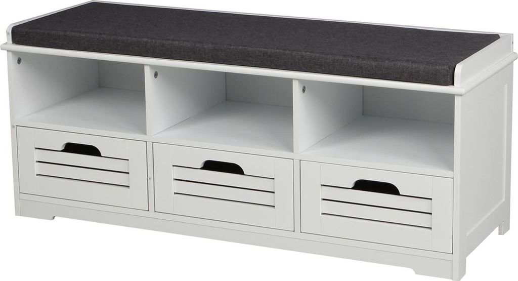 A white shoe bench with a dark gray cushion on top, featuring three open shelves and three drawers with slatted fronts.
