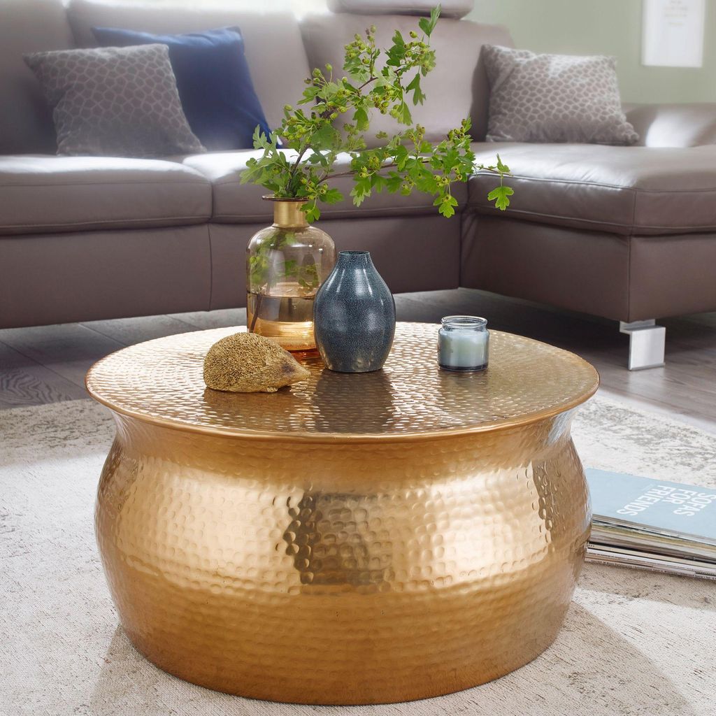 A living room scene with a sectional sofa and a coffee table.