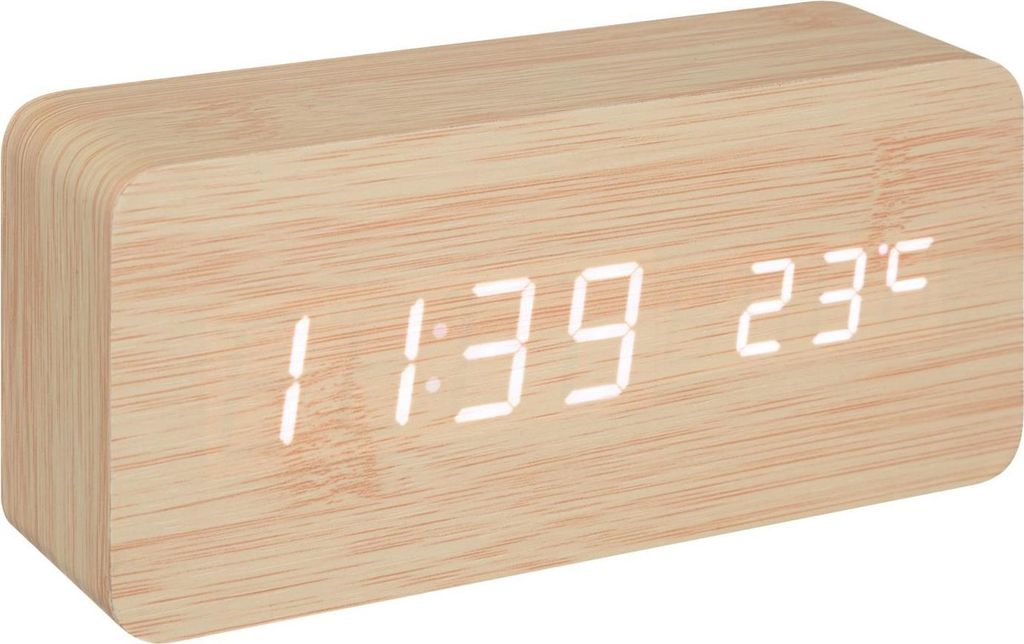 A digital alarm clock with a wood-grain finish displaying the time and temperature.