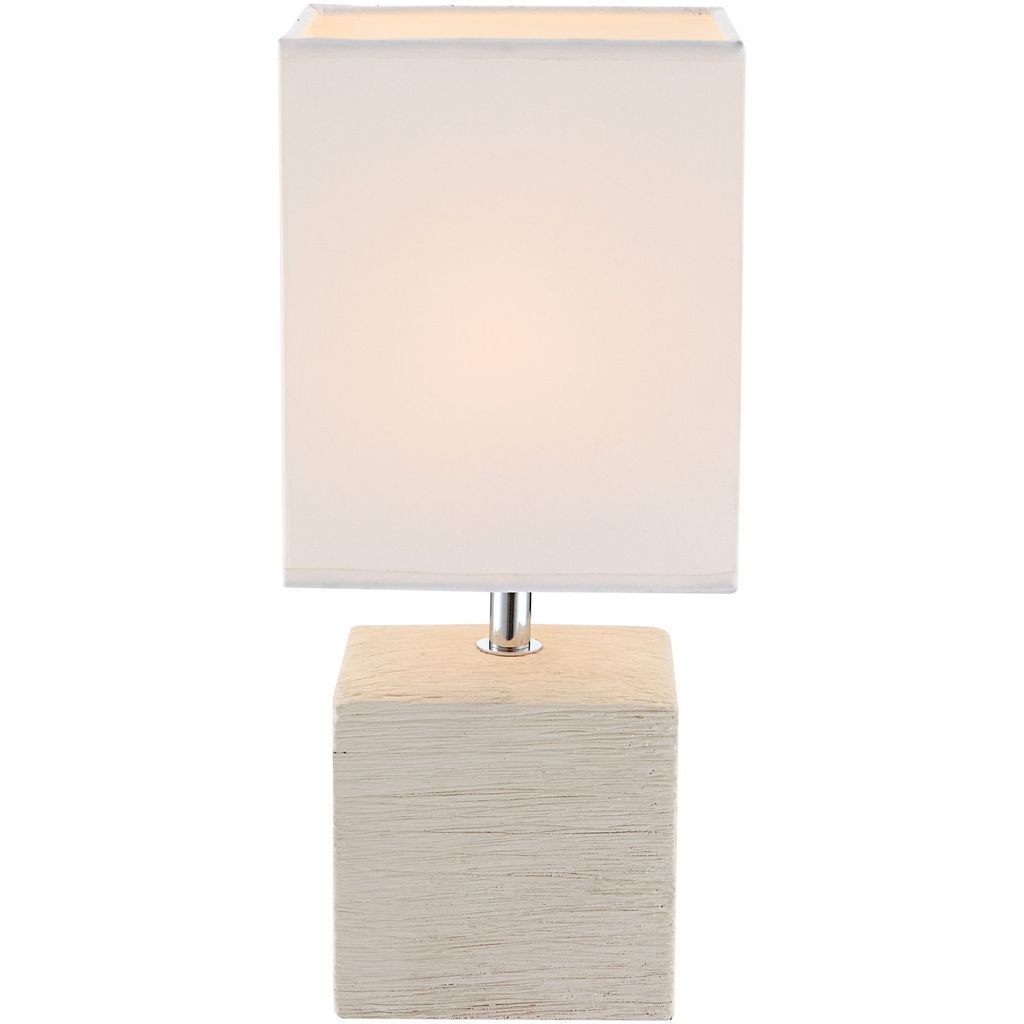 A table lamp with a square white fabric shade and a cube-shaped base with a textured beige finish.