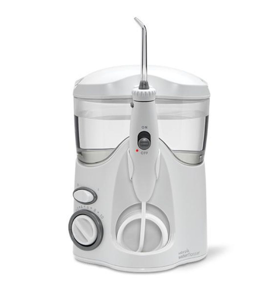 A white Waterpik Ultra water flosser is shown against a white background.