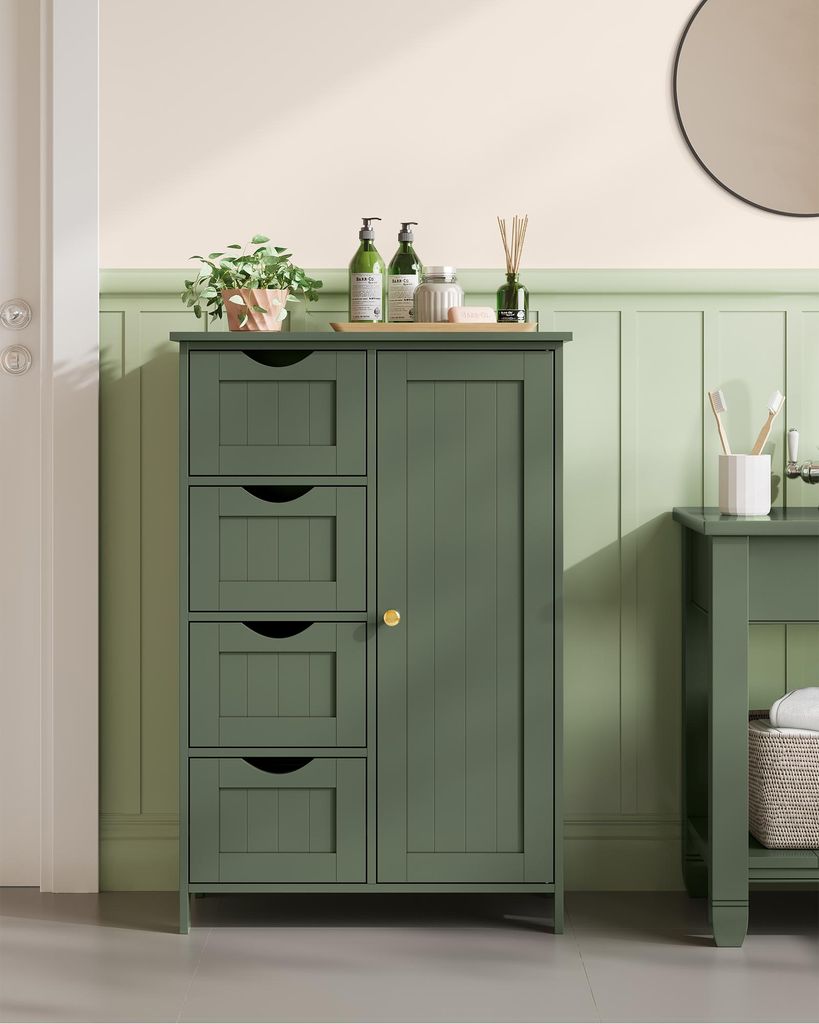 A green bathroom cabinet with four drawers and a single door, placed in a bathroom setting with green paneled walls and a cream-colored upper wall.