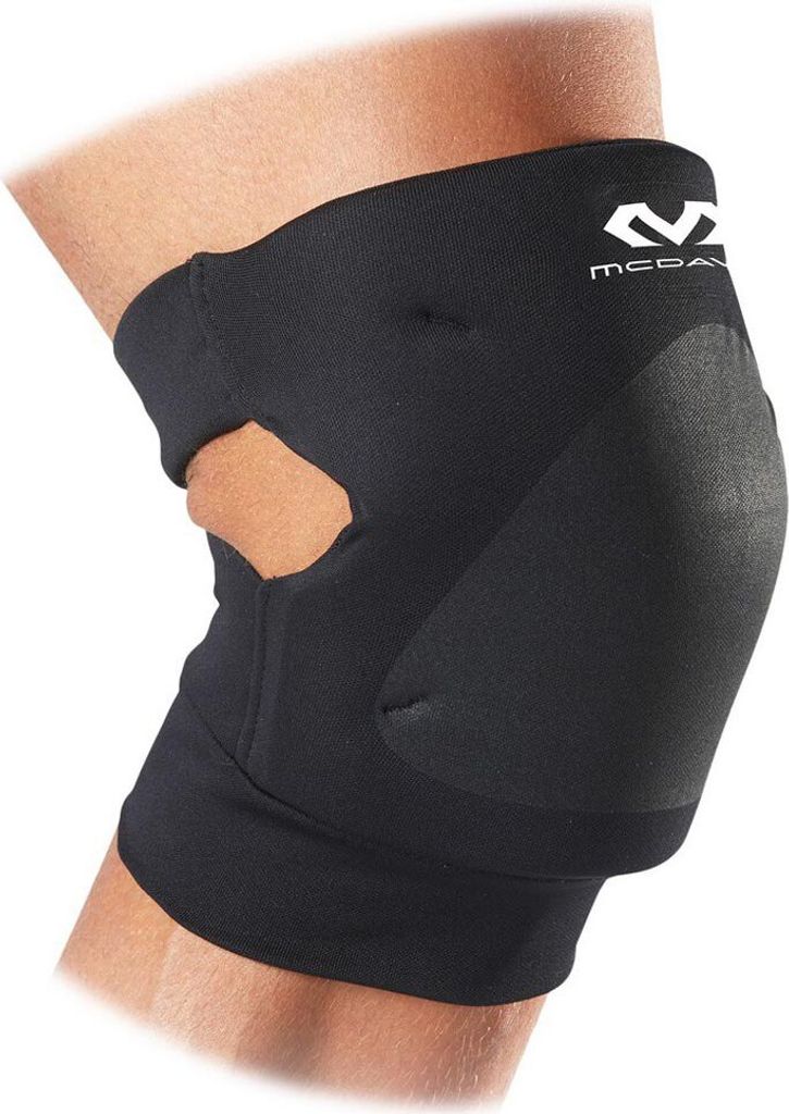A close-up side view of a black knee brace on a person's leg.