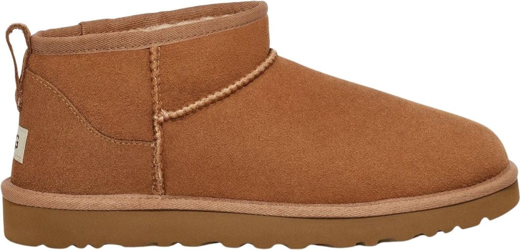 A side view of a single brown Ugg boot.