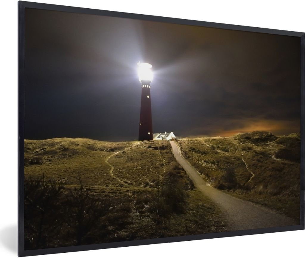 MuchoWow Gerahmtes Poster Ein beleuchteter Leuchtturm auf der Insel Schiermonnikoog 60x40 cm - Poster mit Schwarzem Bilderrahmen Wandposter Rahme...