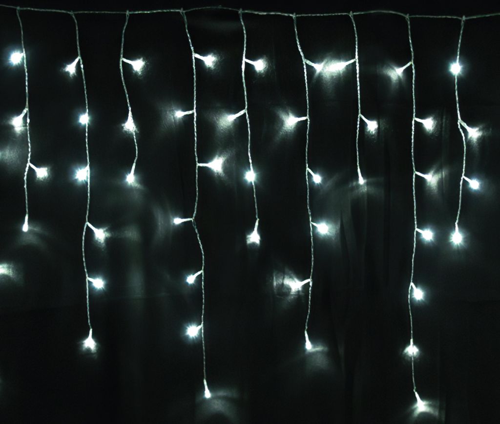 A string of white LED lights hanging against a black background.