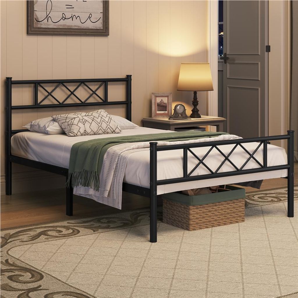 A bedroom scene with a metal bed frame.