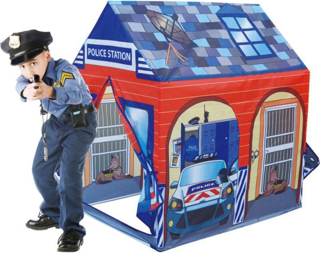 A child dressed as a police officer is playing in front of a police station play tent.