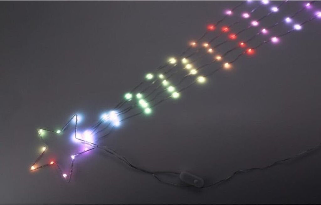 A string of colorful LED lights in the shape of a shooting star, with a star at one end and a switch on the cord.