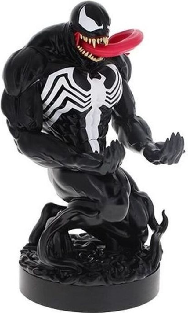 A black and white Venom figurine with its tongue sticking out, posed on a black base.