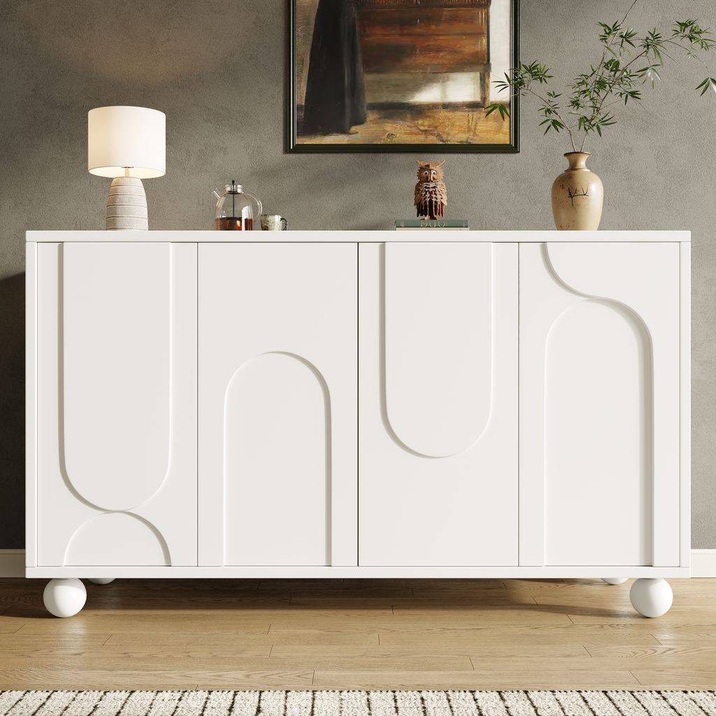 A white sideboard with decorative doors stands in a room with a painting on the wall and a lamp on top.