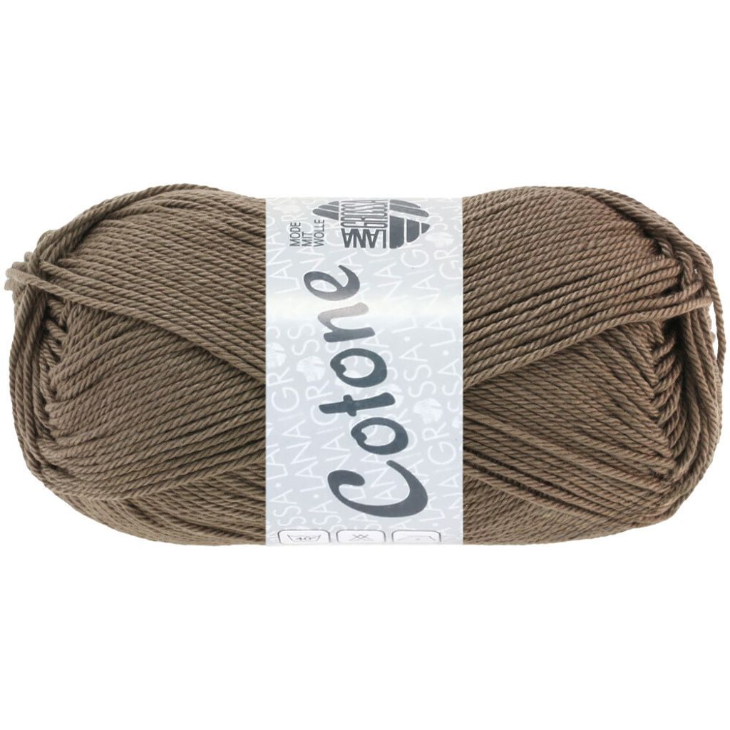 A ball of brown yarn with a label wrapped around it.