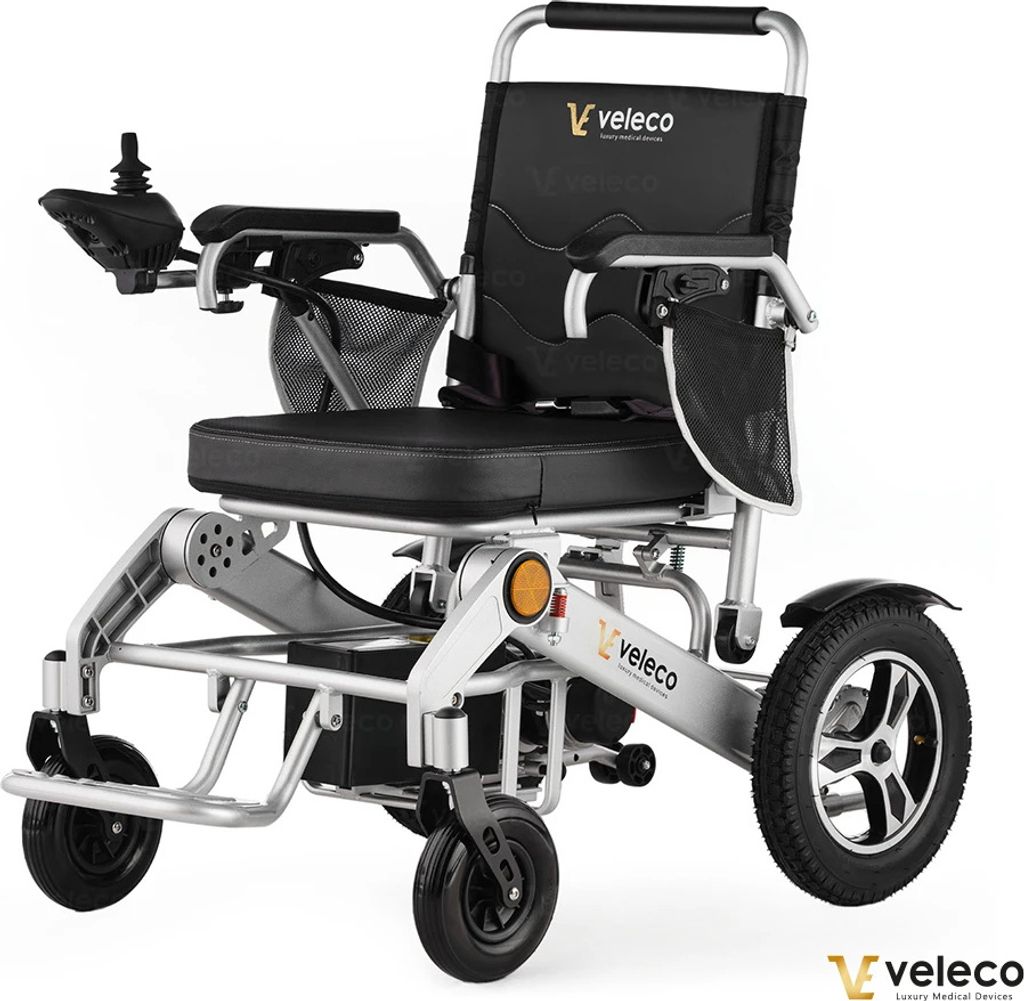 A studio shot of a Veleco electric wheelchair against a white background.