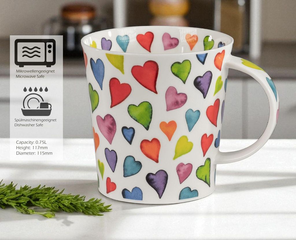 A white mug with colorful heart patterns is shown on a table with some greenery in the foreground. To the left of the mug, there is a panel with icons and text indicating product features.