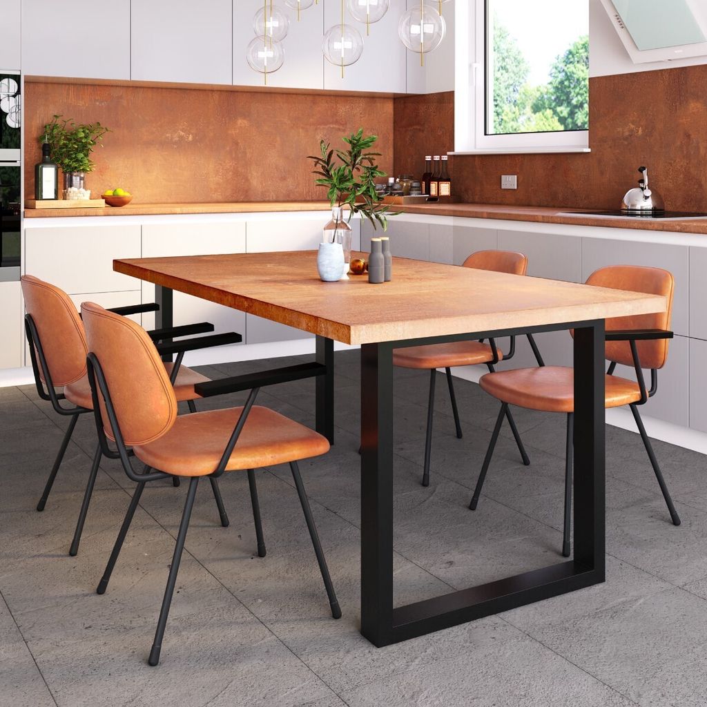 A dining table and chairs set in a modern kitchen.