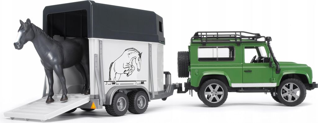 A toy Land Rover Defender towing a horse trailer with a toy horse inside.