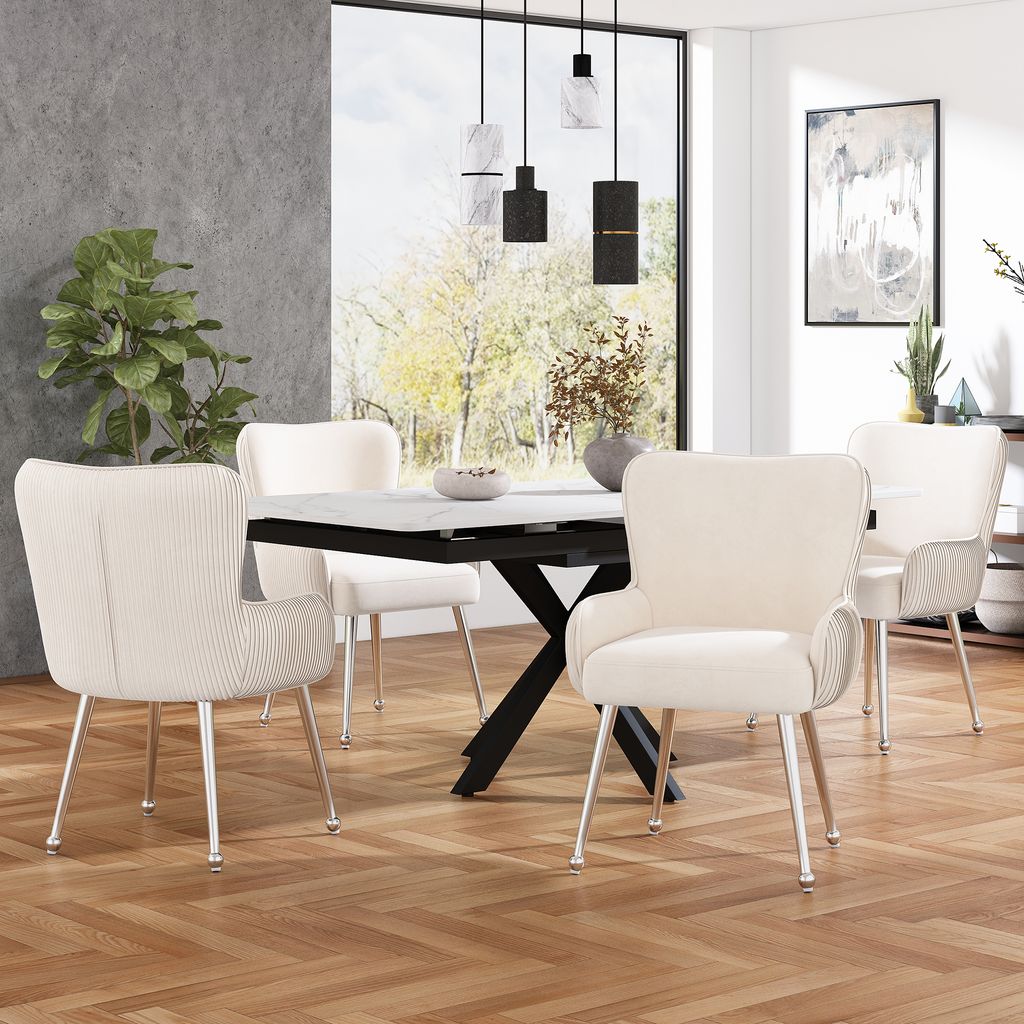 A dining room scene with a table and chairs.