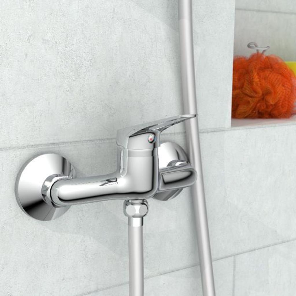 A close-up view of a chrome shower faucet mounted on a tiled wall.